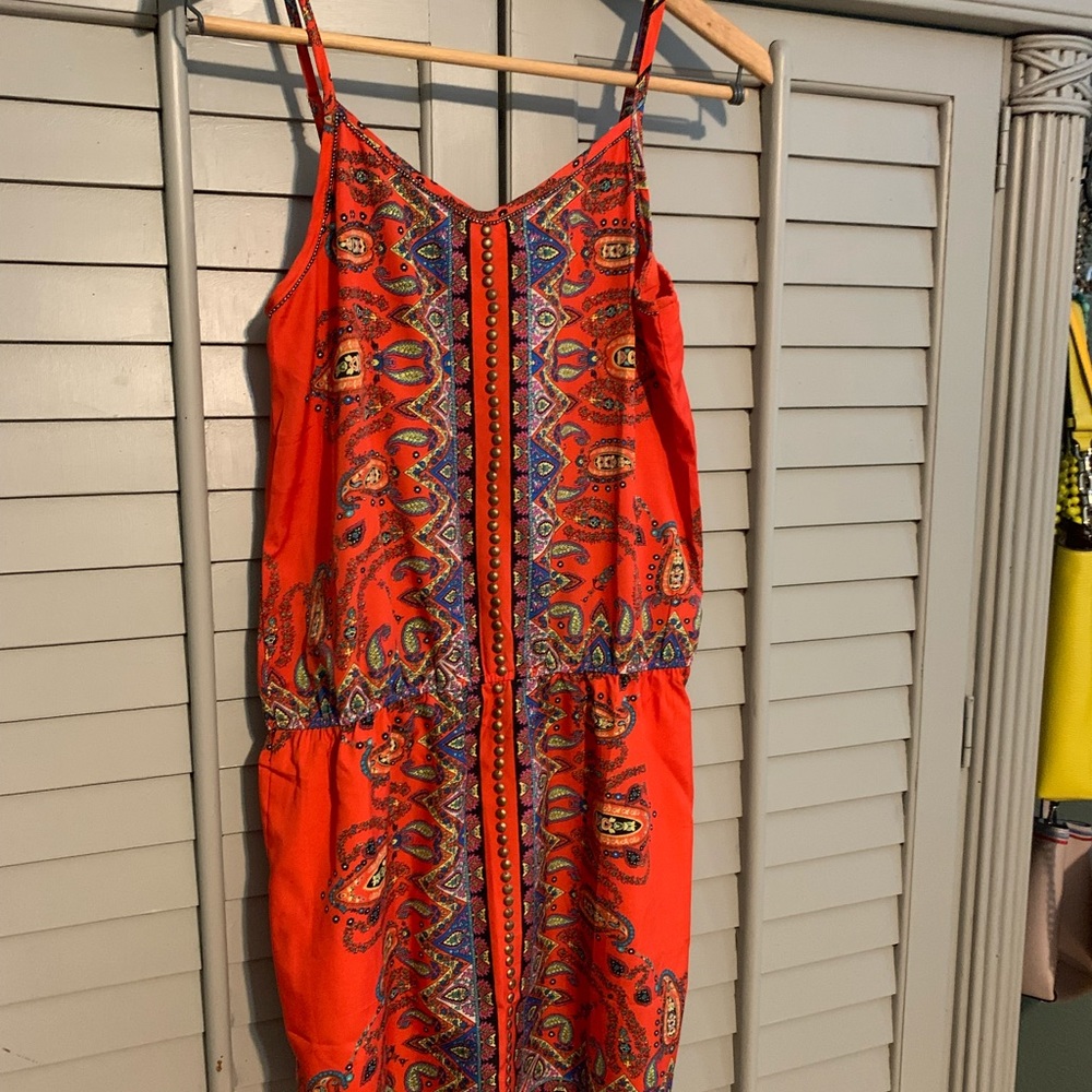 Bright and fun silky tunic top. Elasticized waist.